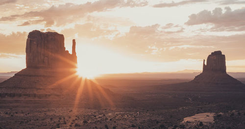 Scenic view of landscape against sky during sunset at monument valley