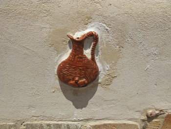 Close-up of animal representation on wall