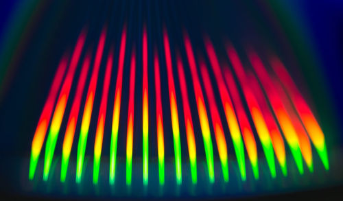 Close-up of multi colored lights over black background