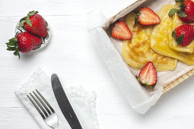 High angle view of strawberries on table