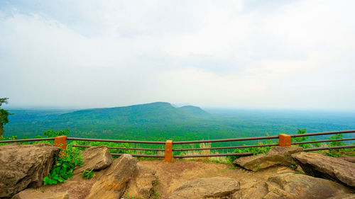 Scenic view of landscape and sea against sky