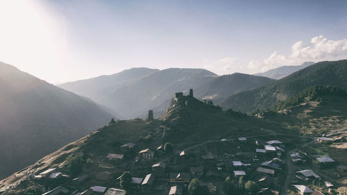 Scenic view of mountains against sky in city