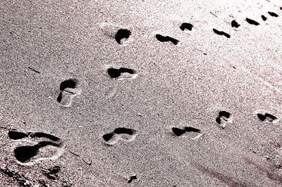 Full frame shot of footprints on sand