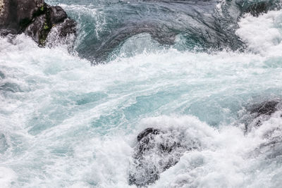 Sea waves splashing on rocks