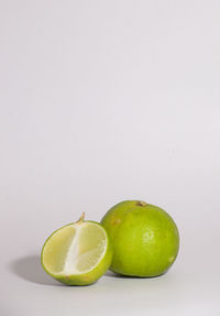 Close-up of fruits against white background