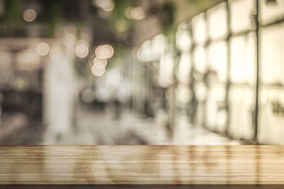 Defocused image of illuminated lights on table