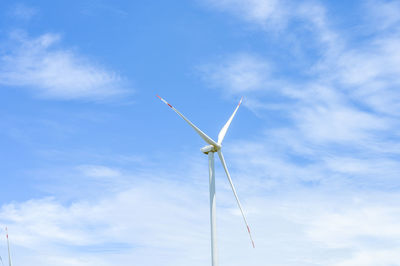 Low angle view of wind turbine against sky