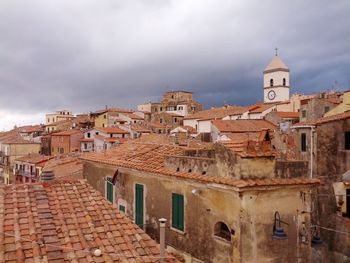 High angle view of town against cloudy sky