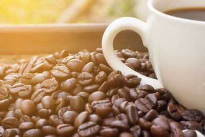 Close-up of coffee beans on table