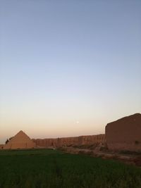 Scenic view of field against sky during sunset