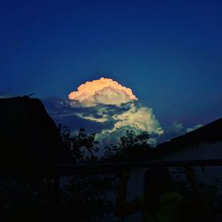 Low angle view of mountain against blue sky