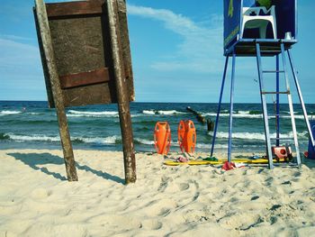 Lifeguard hut on sandy beach during sunny day