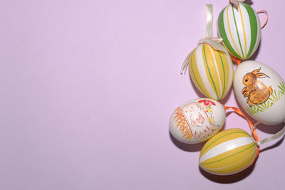 High angle view of easter eggs over pink background