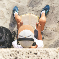 High angle view of man reading book