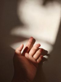 Close-up of hand holding hands