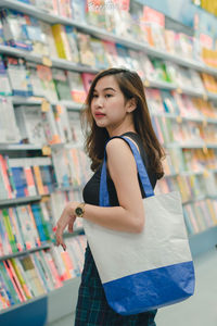 Side view of young woman looking away