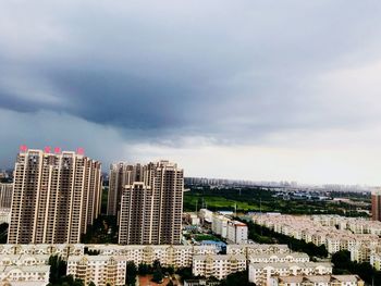 Modern buildings in city against sky