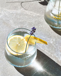 Cool lavender homemade lemonade with lemon slices and lavender flower. detox summer drink.