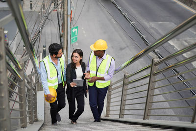 Low angle view of architects standing in city