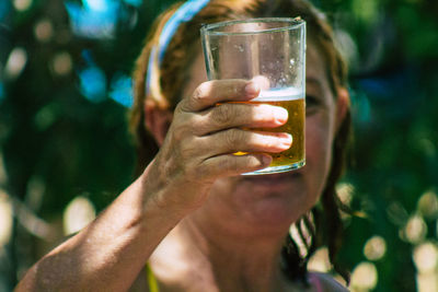 Close-up of man drinking glass