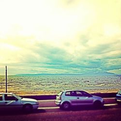 Scenic view of sea against cloudy sky