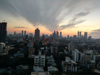 Cityscape against dramatic sky