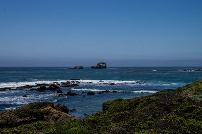 Scenic view of sea against clear sky