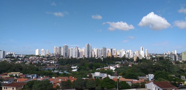 Modern buildings in city against sky