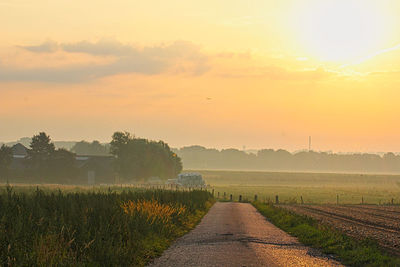 Scenic view of field against sky during sunset