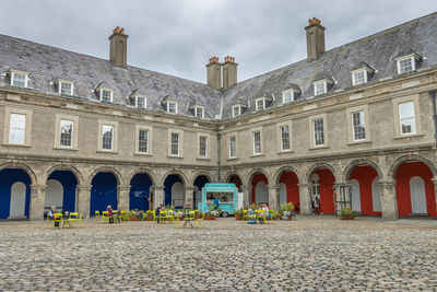 People in front of historic building