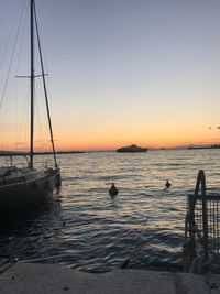 Scenic view of sea against clear sky during sunset