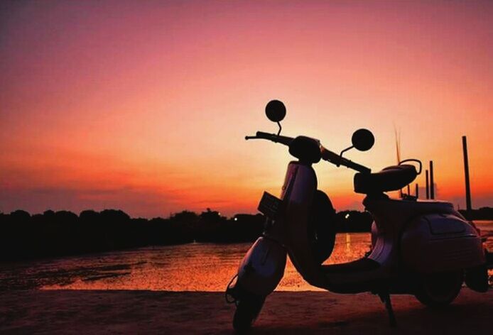 sunset, silhouette, transportation, orange color, sky, mode of transport, land vehicle, sun, bicycle, copy space, one person, dusk, scenics, beauty in nature, tranquility, clear sky, tranquil scene, nature, outdoors, travel