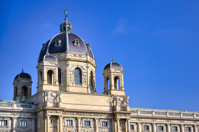 Low angle view of building against blue sky