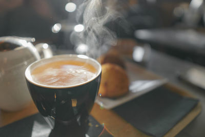 Close-up of coffee cup on table