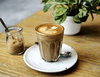 Close-up of coffee in glass on table