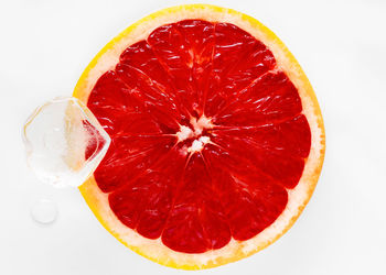 High angle view of lemon slice against white background