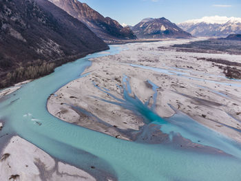 Scenic view of snowcapped mountains by lake