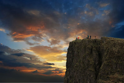 Low angle view of orange mountain against sky during sunset