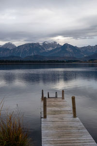 Pier on lake against sky