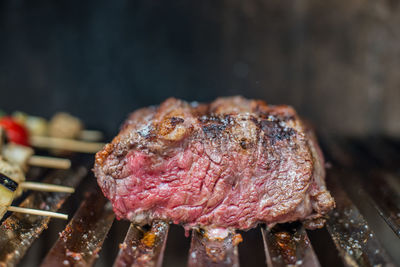 Close-up of meat on barbecue grill