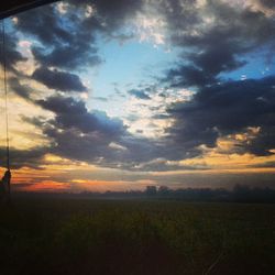 Scenic view of landscape against cloudy sky