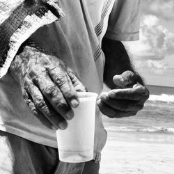 Close-up of young woman holding hands