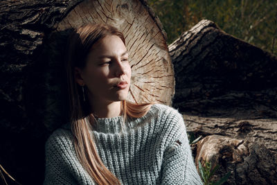 Portrait of beautiful young woman with eyes closed