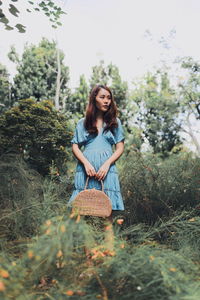 Portrait of beautiful woman on field