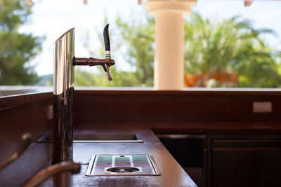 Close-up of telephone booth on table