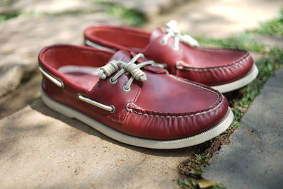 High angle view of red shoes on ground