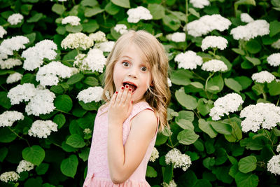 Portrait of girl with pink flowers