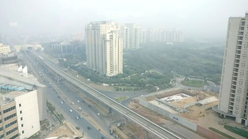 Aerial view of cityscape against sky