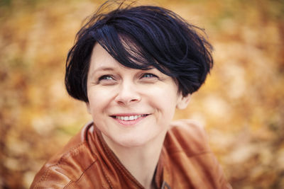 Close-up of smiling woman with short hair