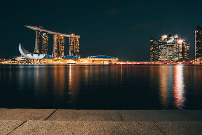 Illuminated buildings at waterfront